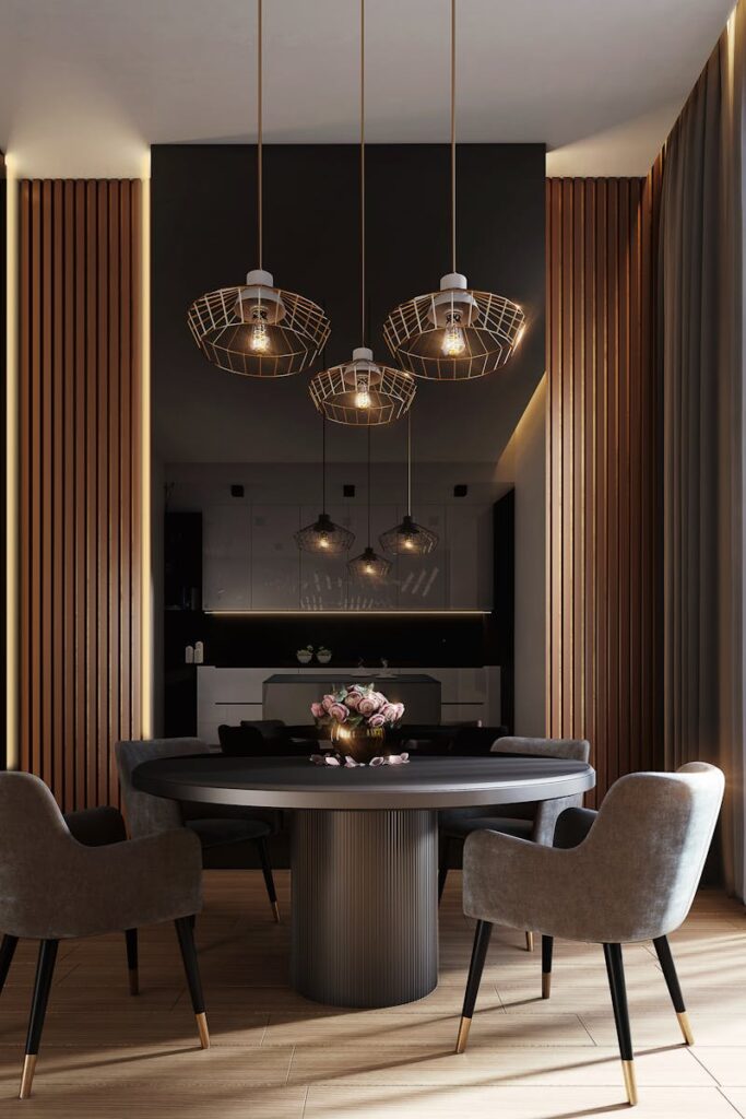 A sophisticated, contemporary dining room with elegant lighting and luxurious furnishings.